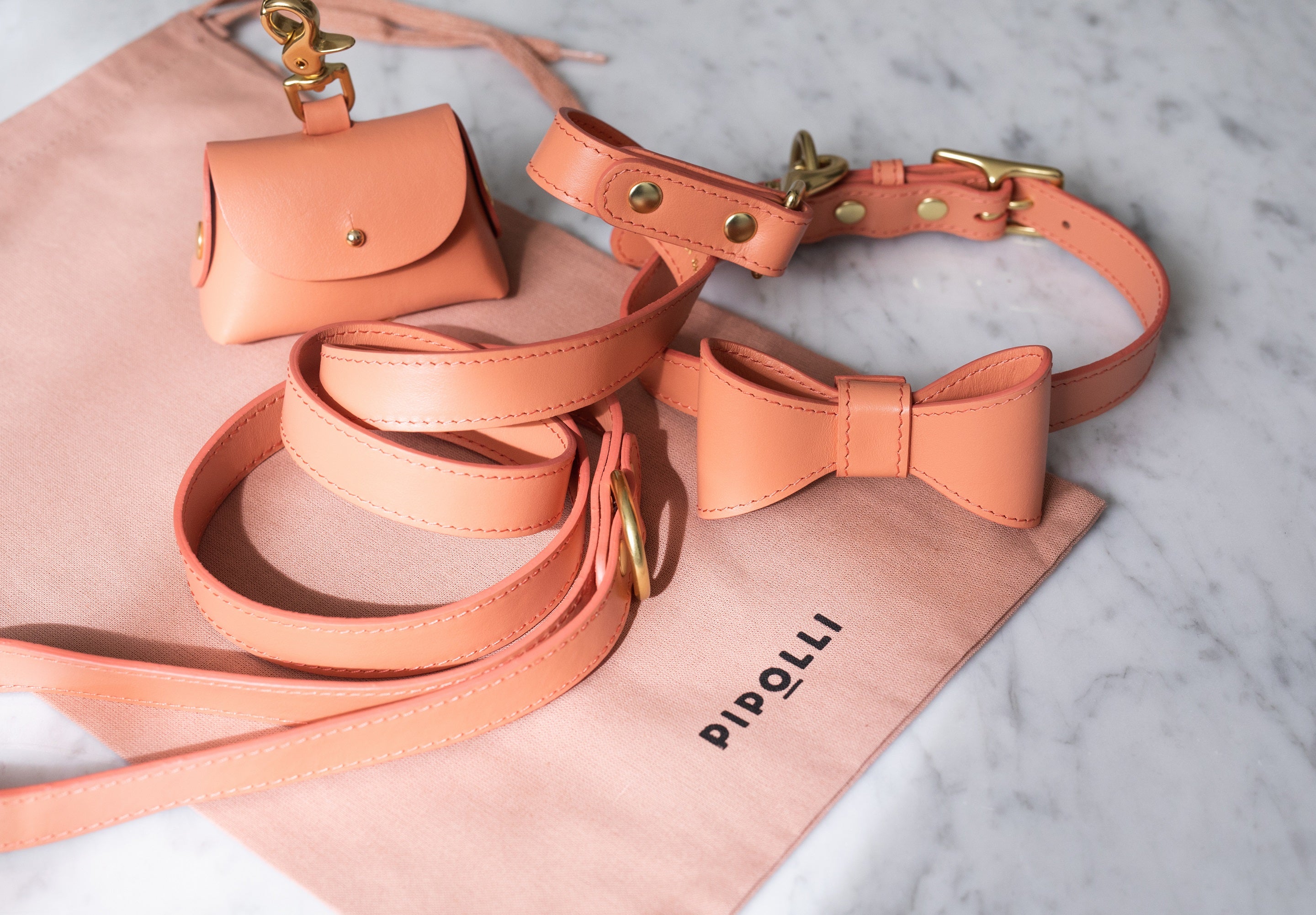 Peach leather collar with removable bow