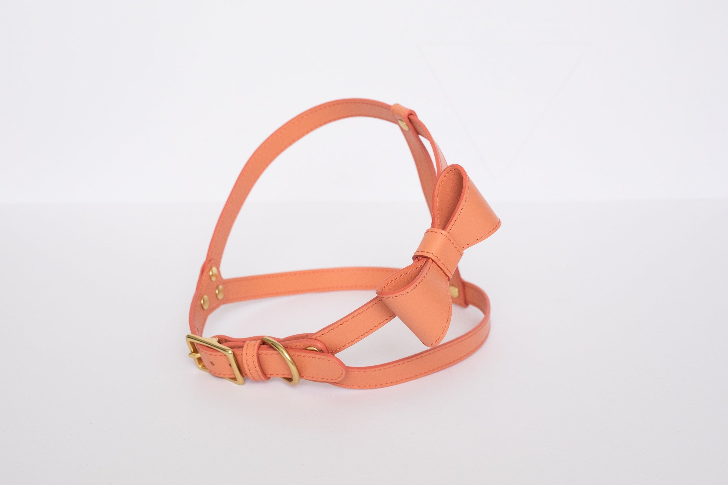 Peach leather harness with removable bow