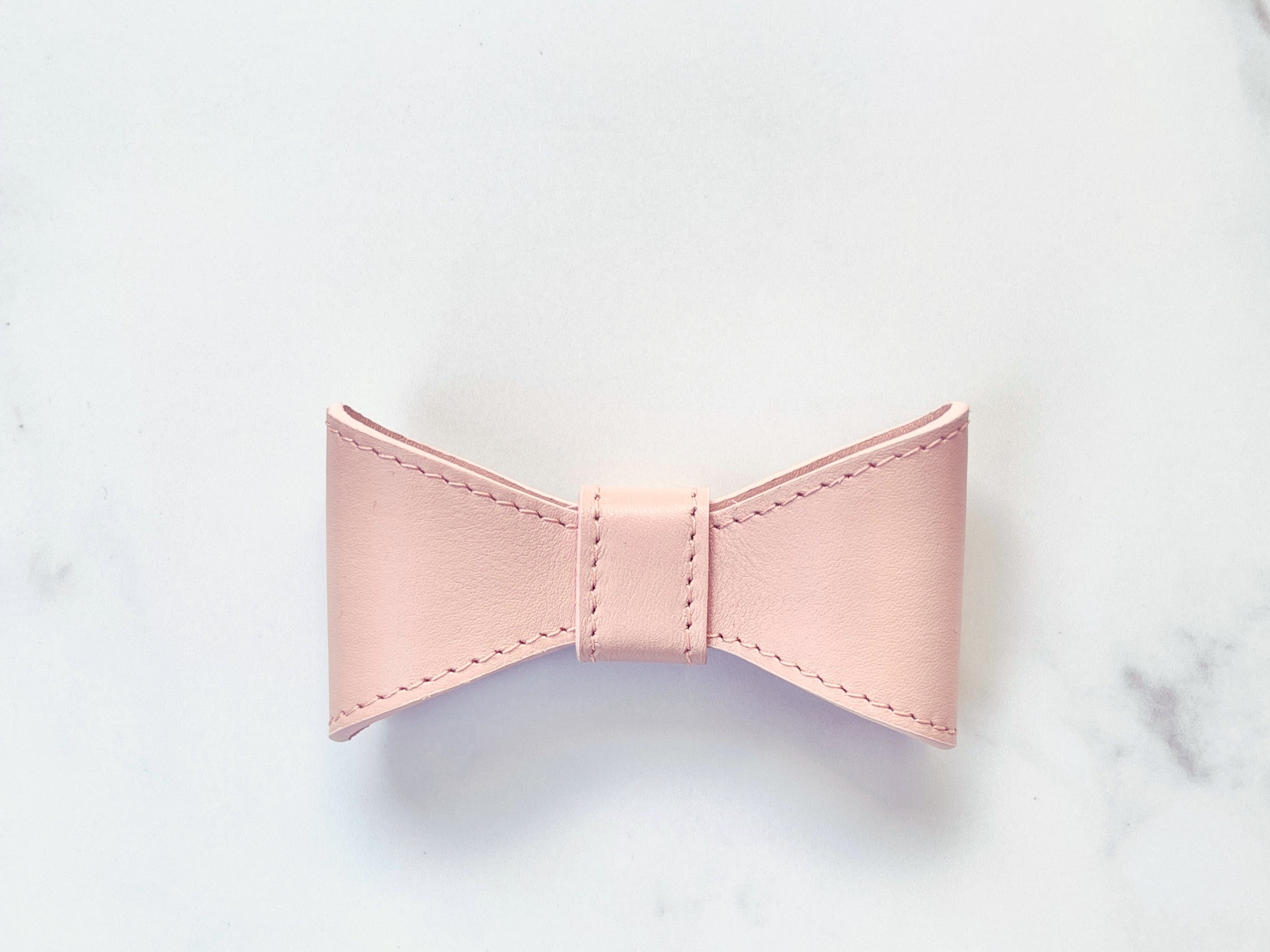 Blush pink leather bow