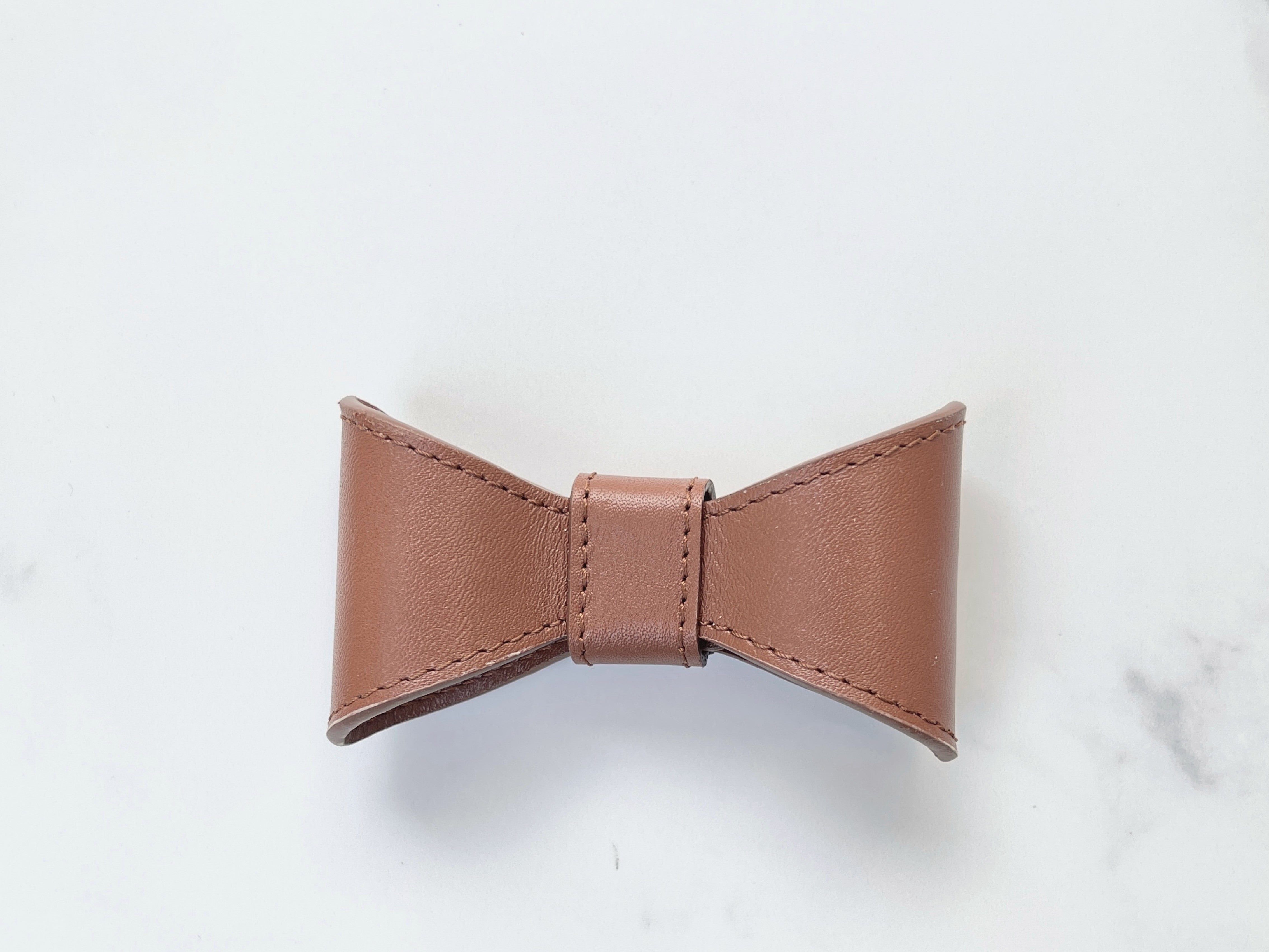 Saddle brown leather bow